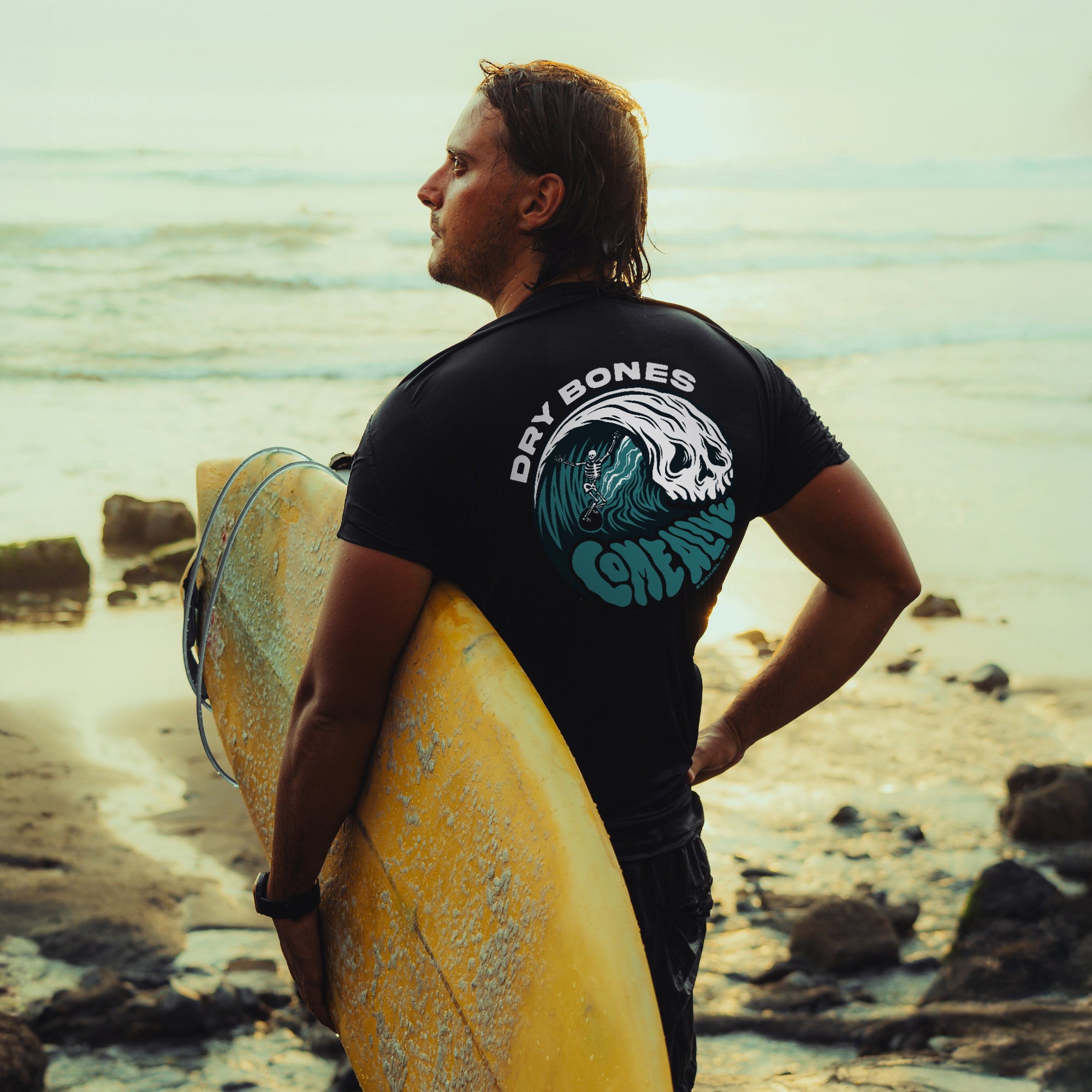 Dry Bones Come Alive T-shirt by Dove at Dawn featuring a graphic print of animated bones on the front.