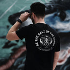 Close-up of the Salt of the Earth T-shirt by Dove at Dawn, showing the fabric texture and detailed print design.